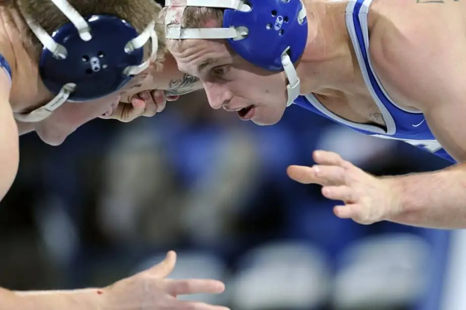 Two Men Grappling In A Standing Position